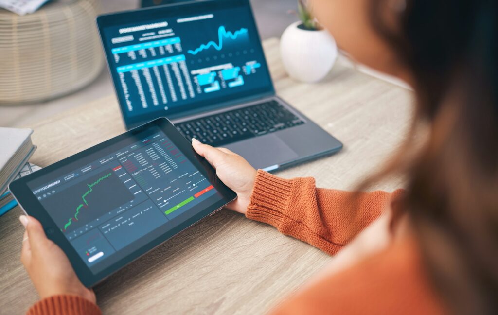 Hands of woman with laptop, tablet and data analytics for research in business management in stock